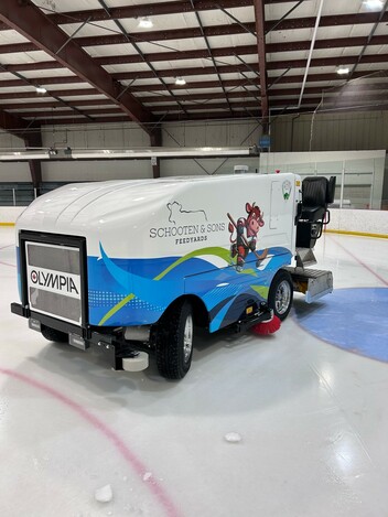 Picture of a blue and white zamboni