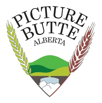 Picture Butte crest with grain and green hills